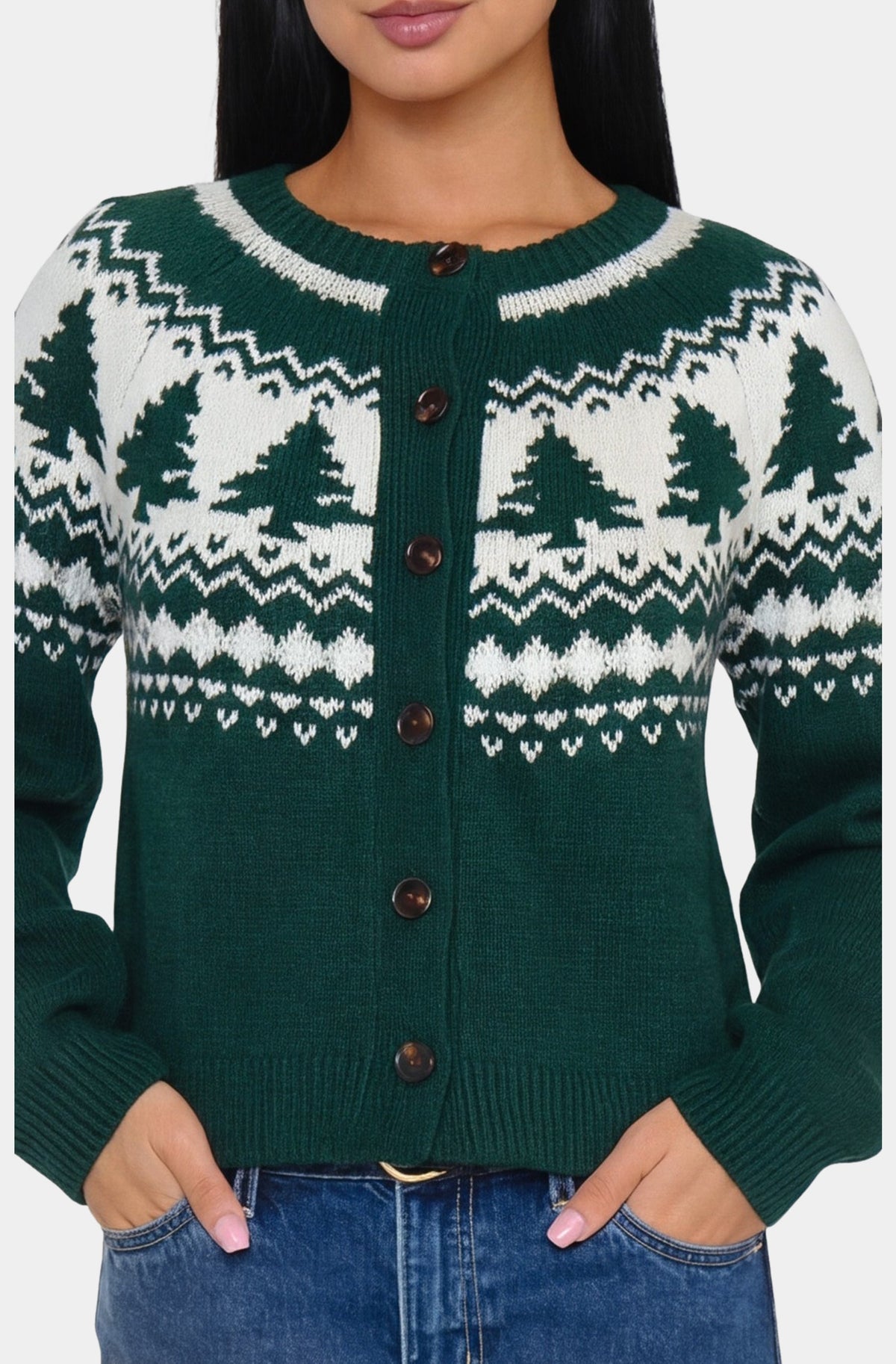 Green and white patterned cardigan worn by a person on a plain background